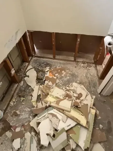 Bathroom opened to the studs after a sewage backup was cleaned up